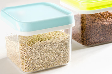 Food storage. Food ingredients (quinoa and brown rice) in plastic containers