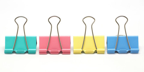 four binder clips: mint, pink, yellow and blue