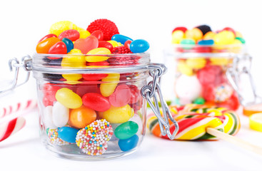 different colorful candy, sweetmeats and chewing gum in a container
